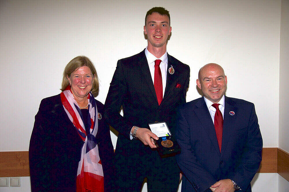 Mark Scott with his Medallion of Excellence in Wall and Floor Tiling.