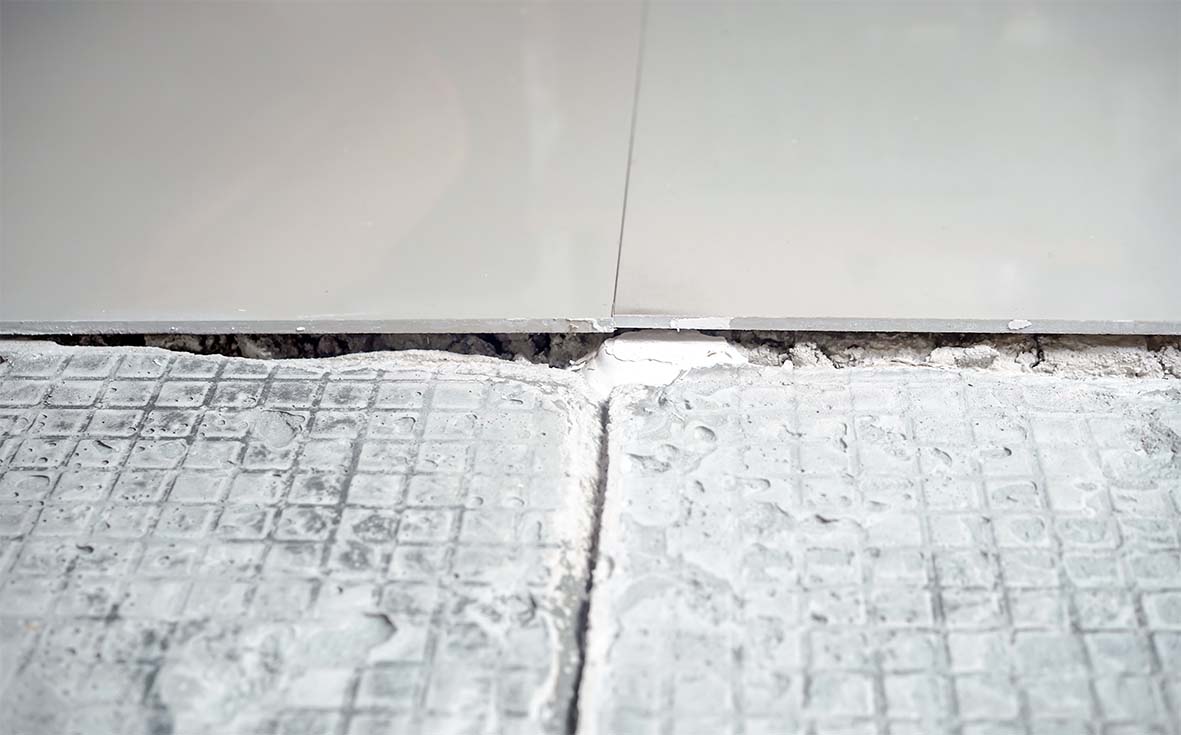 how to remove tile adhesive