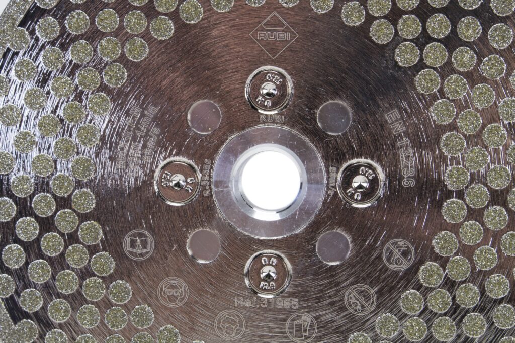 Super close up of diamond grinding pads on the ECD Grinding Blade.