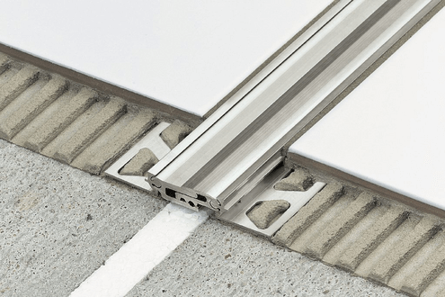 Close up of a movement joint in in between tiles.