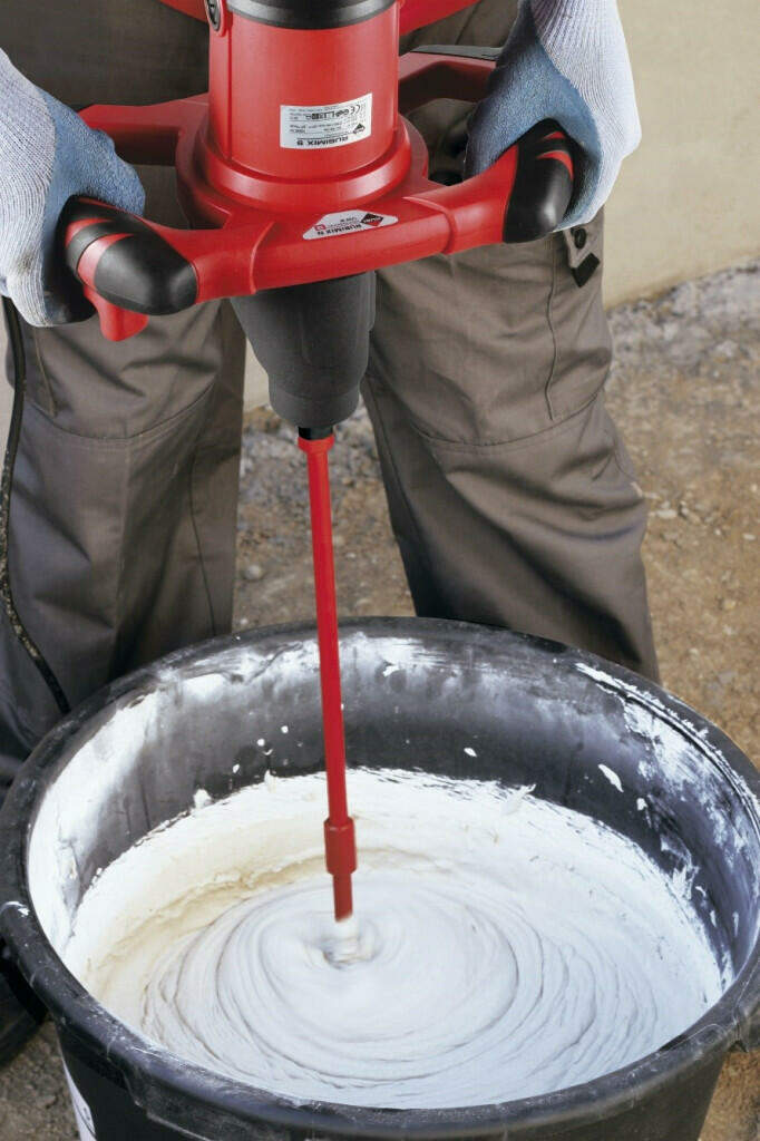 person mixing mortar